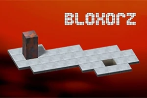 Šedá kocka stojí na platforme s dierou na červenom pozadí, s nápisom vytvoreným z bodiek