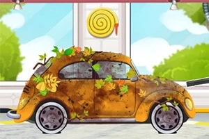 Špinavé auto pokryté lístím a blatom stojí v myčke