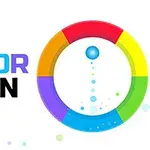 Viacfarebný kruh s modrou loptou uprostred a nápisom COLOR SPIN vedľa
