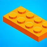 Oranžová lego kocka na modrom pozadí
