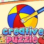 Štetec maľuje farebnú loptu na papieri s názvom Creative Puzzle a pastelovými okrajmi