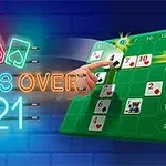 Neónový nápis CROSS OVER 21 s dvoma kartami a ženskou rukou ukazujúcou na hracie pole s kartami