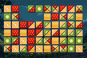 Farebná mozaika štvorcových dielikov s bodkami, pruhmi a geometrickými vzormi v červenej, žltej a zelenej na tmavom pozadí