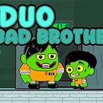 Dvaja kreslení zelení bratia v oranžových kombinézach stoja pred dverami s nápisom EXIT a veľkým nápisom „DUO BAD BROTHERS“ hore