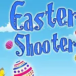 Nápis Easter Shooter s farebnými veľkonočnými vajíčkami a motýľom na modrom pozadí s oblakmi