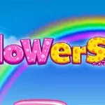 Nápis flowers v ružovo-žltých písmenách s kvetinovým motívom na pozadí dúhy a modrej oblohy
