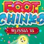Farebný nápis s textom Foot Chinko na zelenom pozadí s farebnými konfetiami a futbalovou loptou