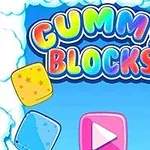 Farebné želé kocky na modrom pozadí s oblakmi a dúhou