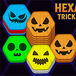 Hexa Sort Trick or Treat Farebné šesťhranné bloky s vystrašenými tvárami a strašidelná ruka na fialovom pozadí s nápisom „Hexa Sort: Trick or Treat“