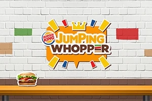 Logo Jumping Whopper na tehlovej stene s obrázkom burgra na stole v popredí