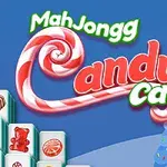 Text MahJongg Candy Cane s cukríkovými špirálami na modrom pozadí s vianočnými stromčekmi a domčekmi