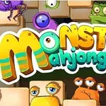 Farebné karikatúrne príšerky obklopujúce text Monster Mahjong na pozadí so štvorcovými kameňmi