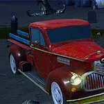 Starý červený pickup zaparkovaný na cintoríne s náhrobnými kameňmi a kostrami