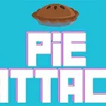 V strede obrázka sú výrazné biele písmená PIE ATTACK na modrom pozadí s ilustrovaným koláčom nad písmenami