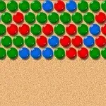 Farebná mozaika s radmi modrých, červených a zelených guličiek na béžovom pozadí