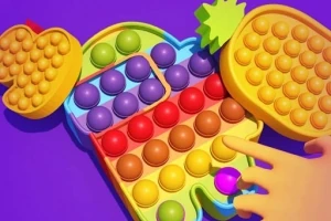 Farebný pop it v tvare postavičky s rôznymi bublinami a motívom ovocia na fialovom pozadí