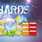 Farebná rozbitá stena zložená z oranžových, žltých a zelených blokov na modrom pozadí s nápisom „SHARDS“