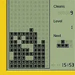 Pohľad na displej retro elektronickej hry s padajúcimi blokmi v žltom ráme s čiernobielym rozhraním